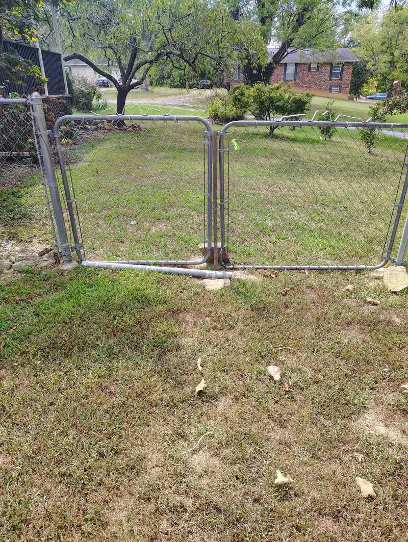 Chain-link double gate set in a new fence