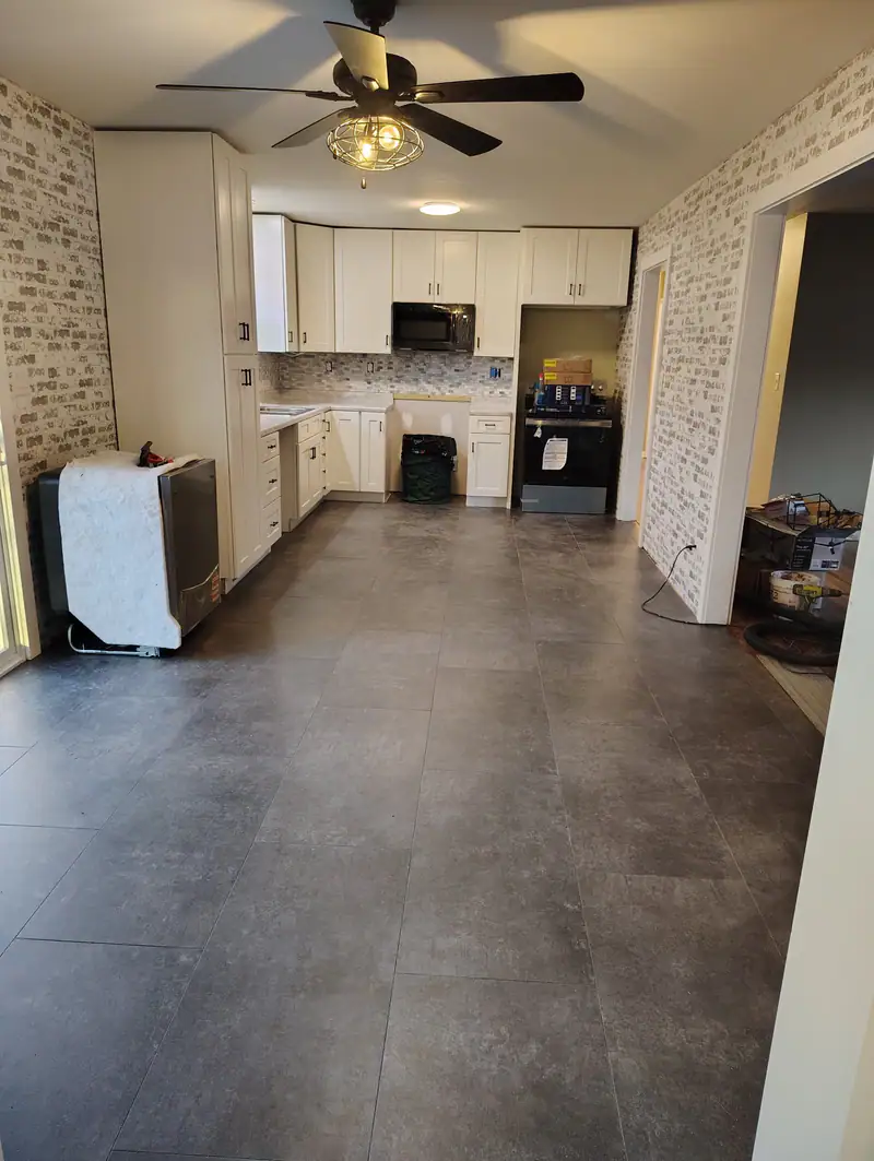 Kitchen and dining space with a new large-format tile floor