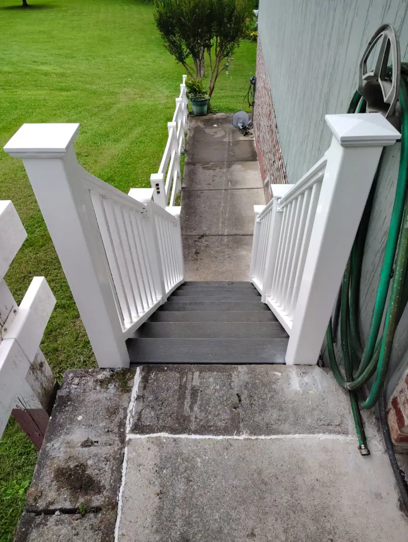 New back steps with white railings, seen from the top
